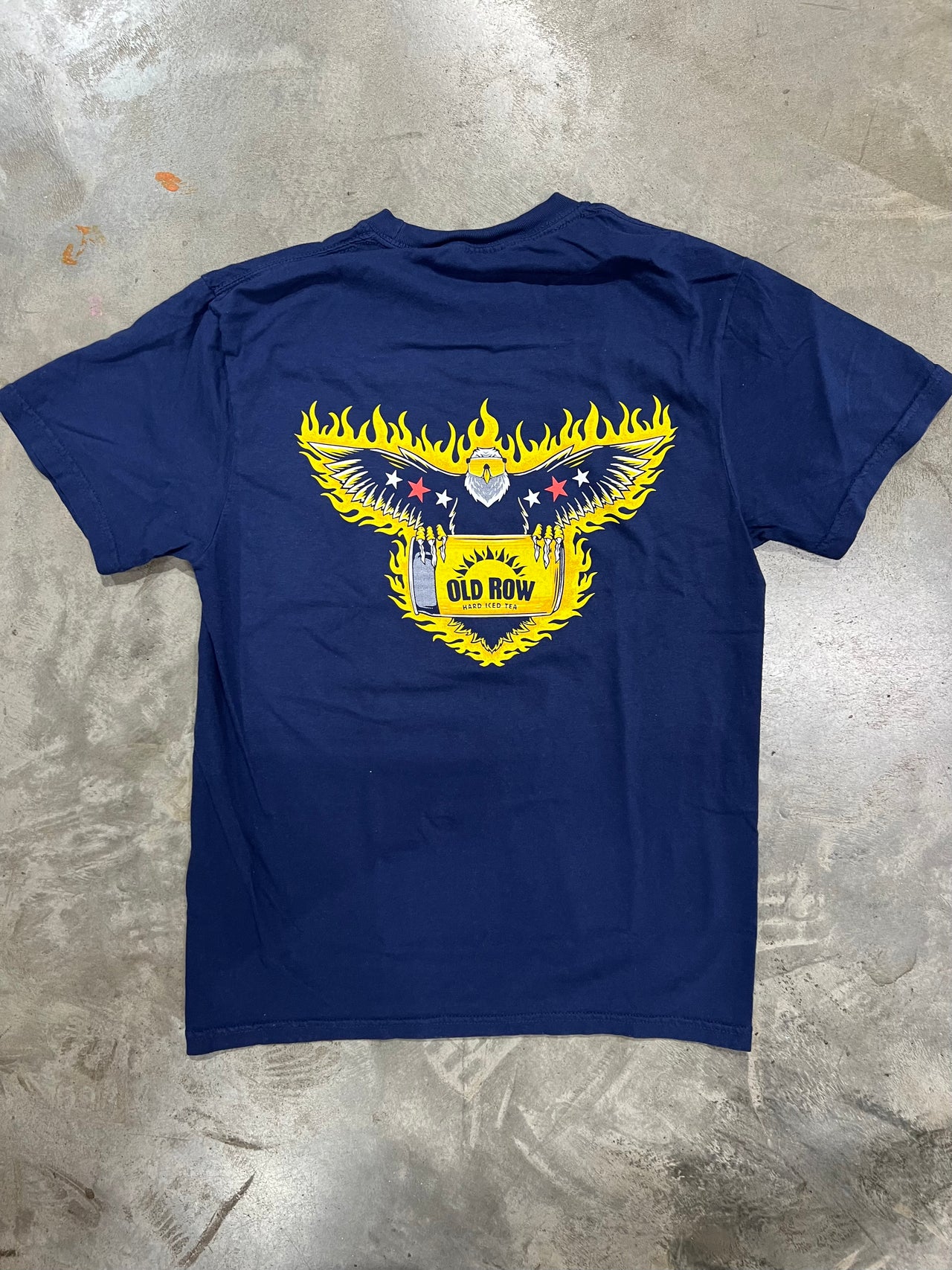 American Eagle with a Twisted Tea on fire on a short sleeve shirt.
