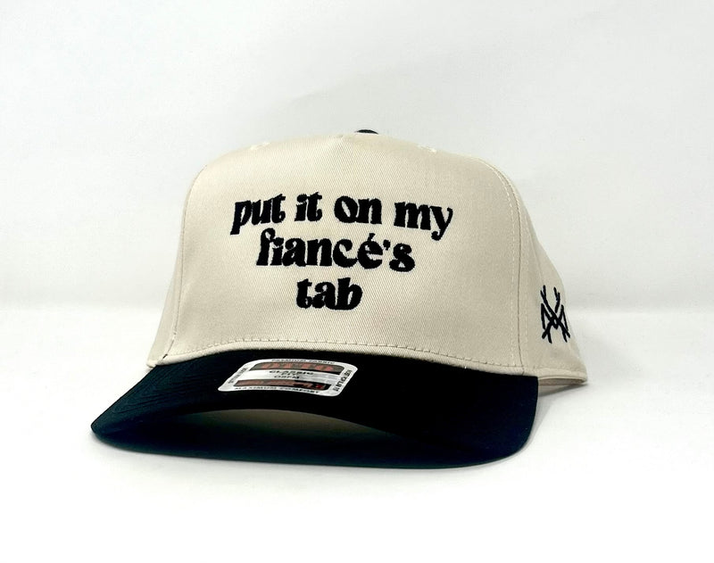 MHC Put It On My Fiance's Tab Trucker Cap - Black/Natural