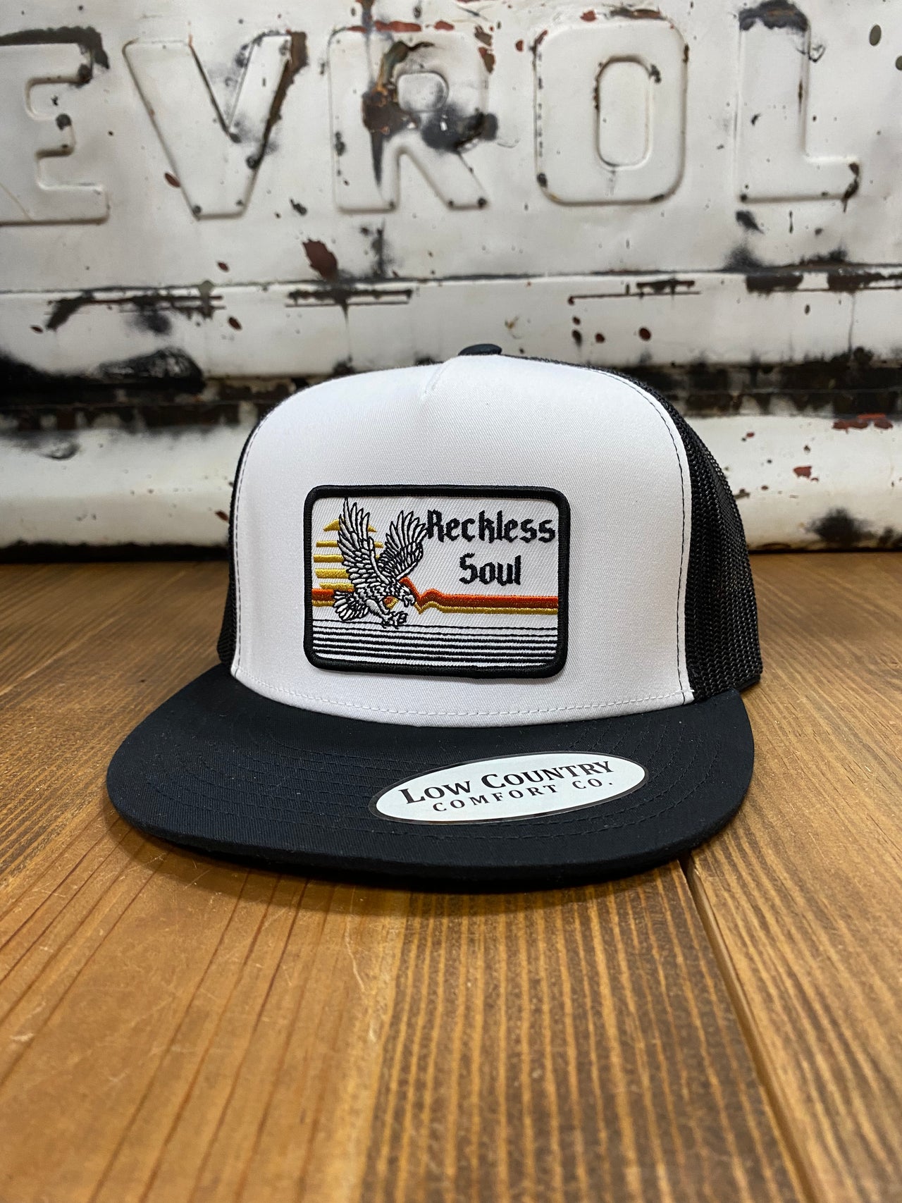 Black/White/Black Reckless Soul Eagle Patch 5 Panel Cap - A stylish masterpiece with a vibrant embroidered eagle patch. Durable 5-panel construction for a snug fit. Express your bold and untamed spirit with this daring accessory, perfect for any occasion.