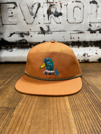 Thumbnail for Terracotta-colored cap featuring a duck head emblem on the front, made from 100% cotton with a 550 paracord for durability. The mid-crown design, adjustable snapback, and one-size-fits-most feature make it a versatile and stylish accessory for various occasions.