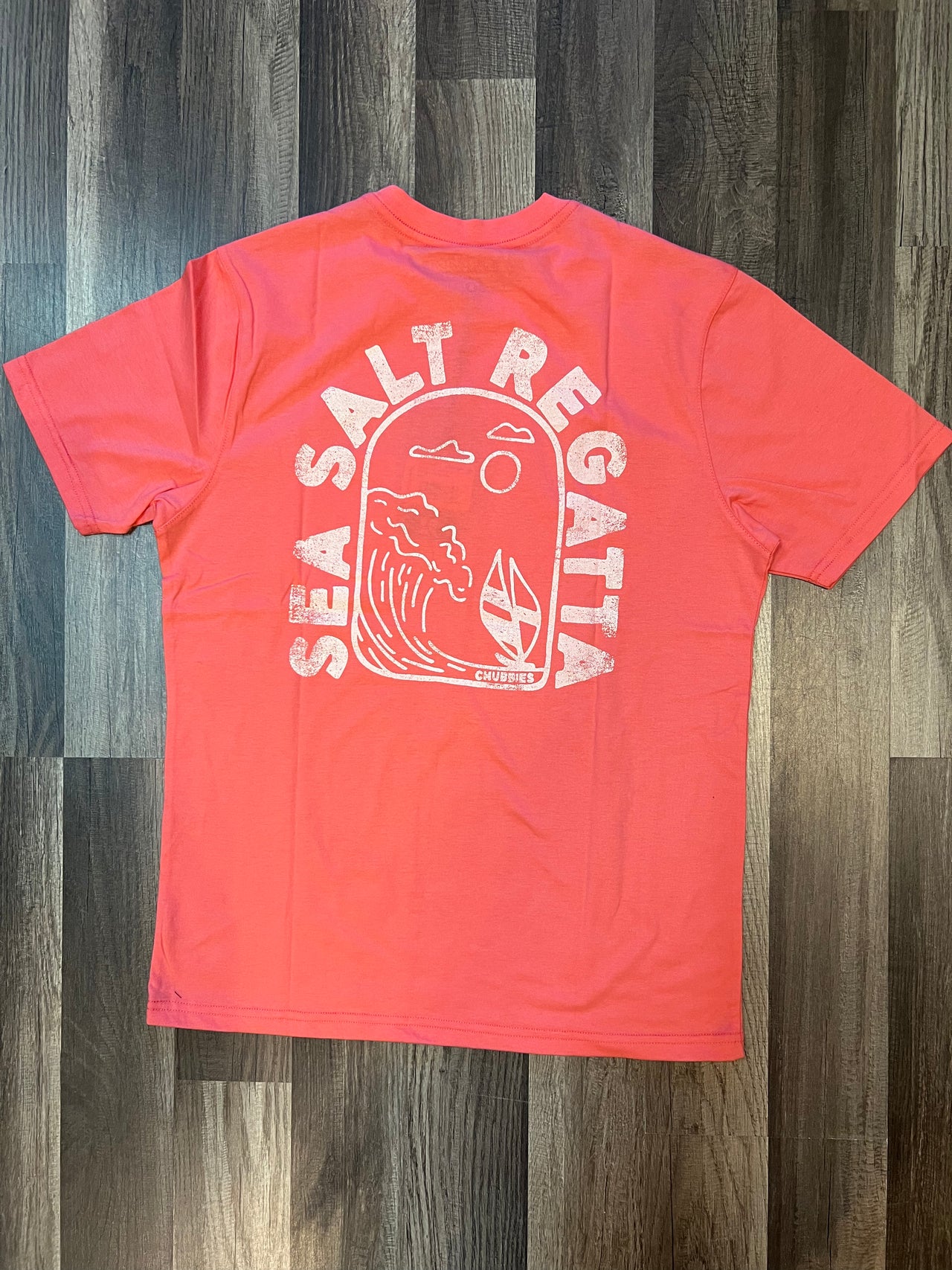  "Chubbies Sea Salt Regatta Pink Short Sleeve Pocket T-Shirt - A soft and durable cotton tee in a refreshing sea salt pink hue. Features a tailored fit, classic crew neckline, and a functional pocket for a touch of nautical charm. Perfect for laid-back style and seaside adventures."
