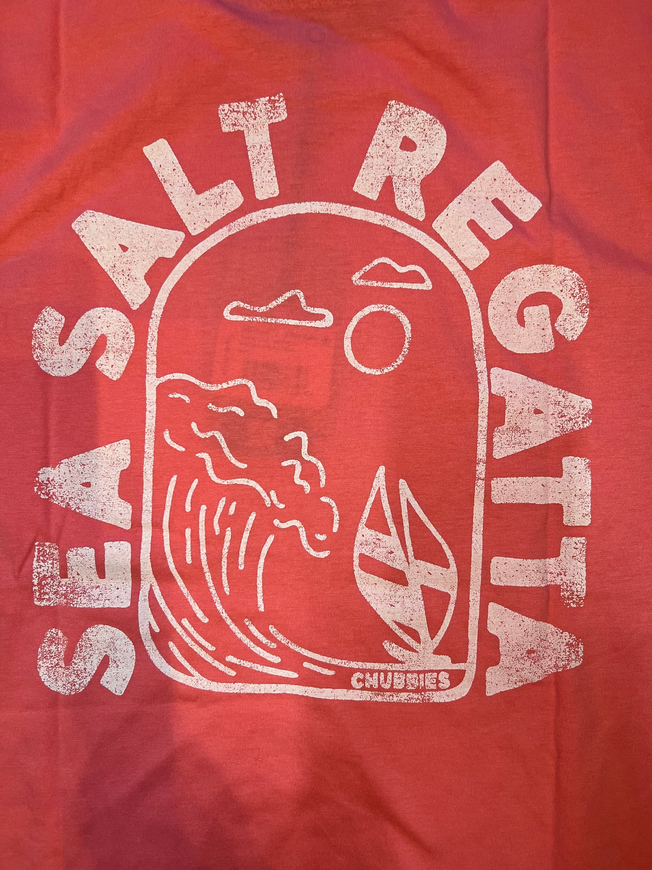  "Chubbies Sea Salt Regatta Pink Short Sleeve Pocket T-Shirt - A soft and durable cotton tee in a refreshing sea salt pink hue. Features a tailored fit, classic crew neckline, and a functional pocket for a touch of nautical charm. Perfect for laid-back style and seaside adventures."