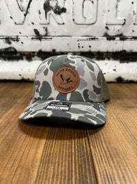 Thumbnail for Home Bound Flying Duck Leather Patch Trucker Cap - Marsh Green Duck Camo