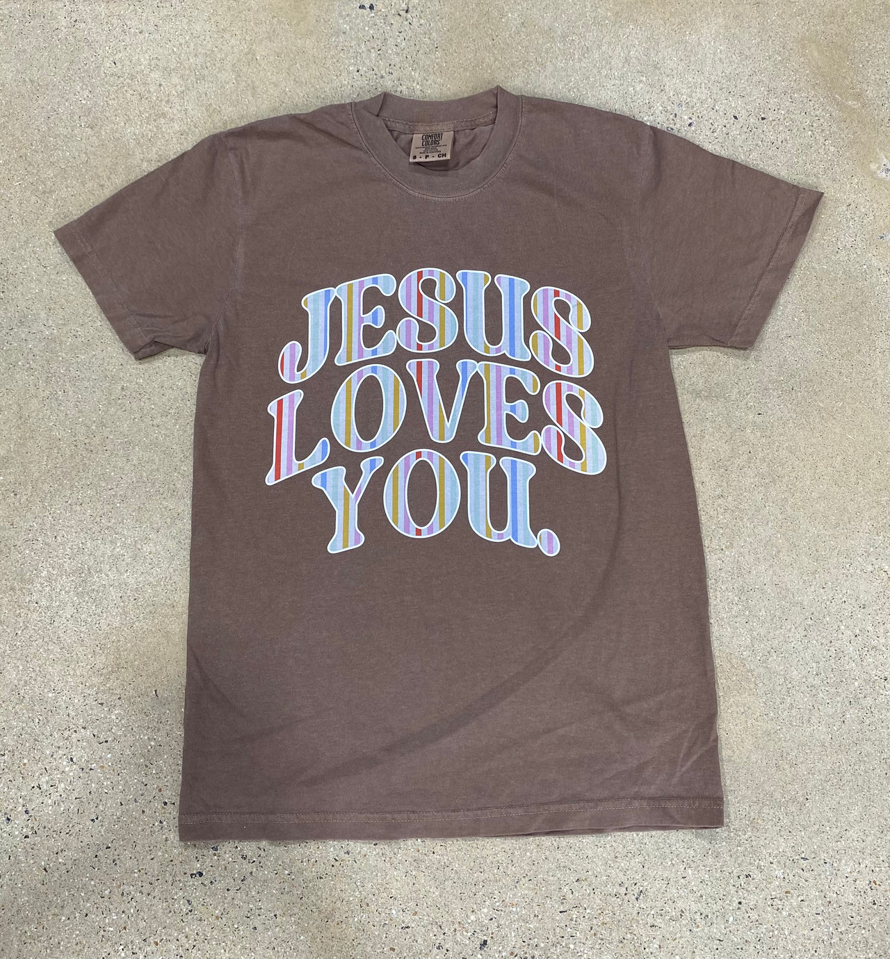 Espresso brown Jesus Loves You graphic tee with colorful striped lettering