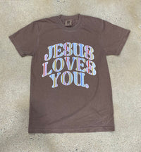 Thumbnail for Espresso brown Jesus Loves You graphic tee with colorful striped lettering