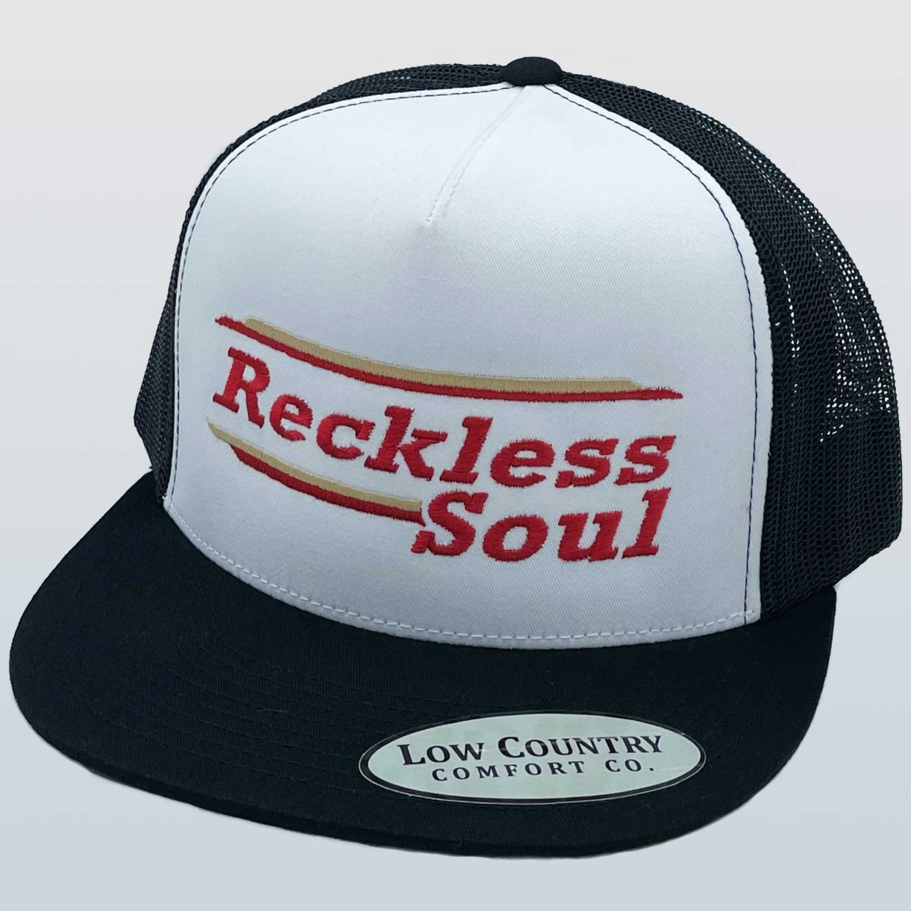 Reckless Soul 'The Cup' 5 Panel Cap in White/Black - A symbol of bold individuality and untamed style. Meticulously crafted with a distinctive design, the contrasting colors and iconic logo capture the essence of rebellion. The unique 5-panel construction ensures all-day comfort, making this cap a powerful statement piece for everyday adventures.