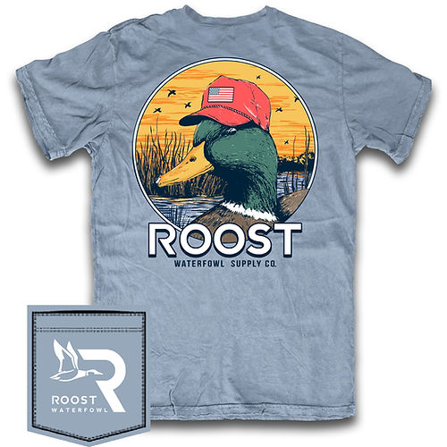 Roost wood duck with red american flag hat on with sunset background. blue jean color short sleeve pocket t-shirt