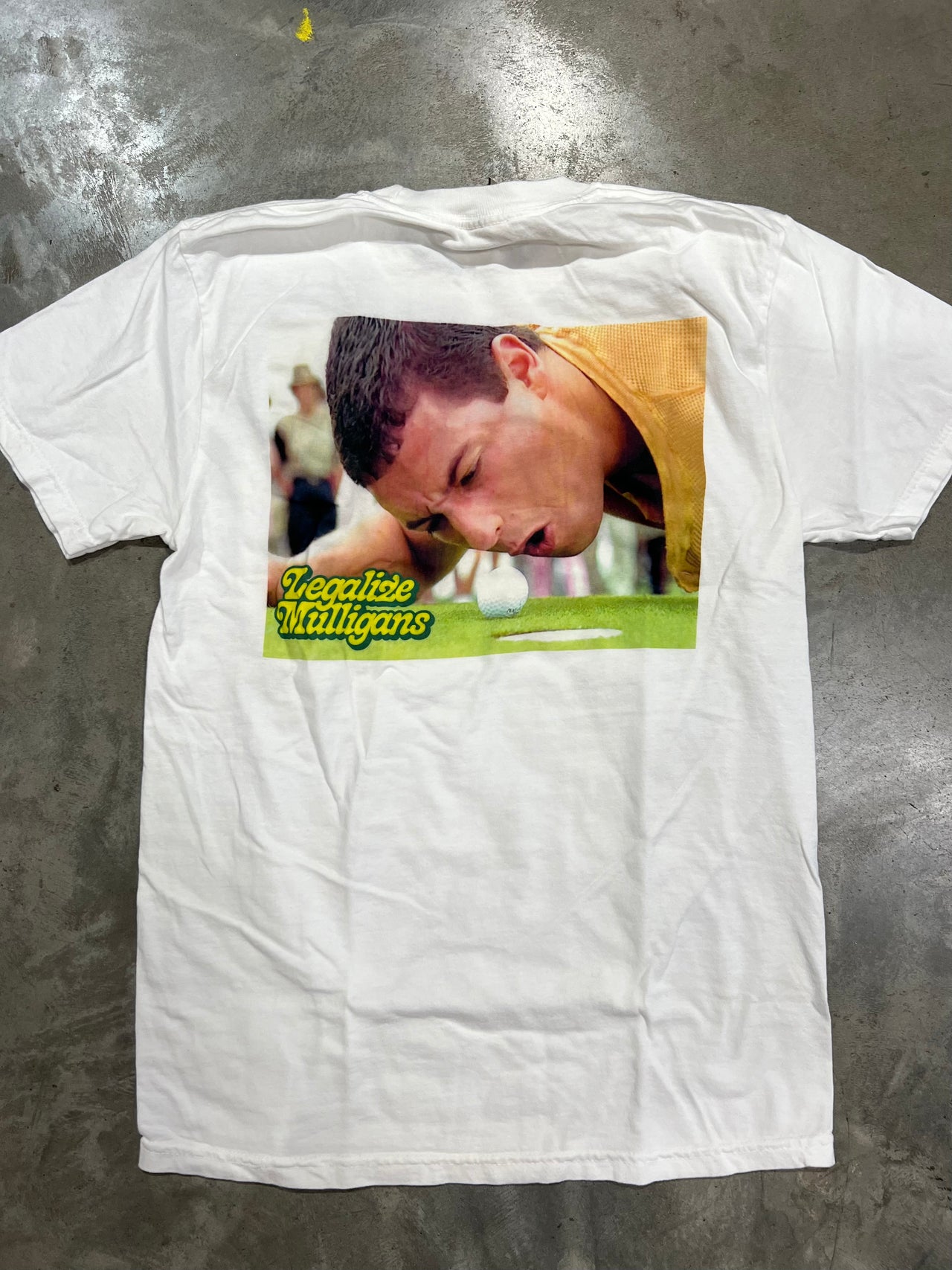 Adam Sandler in the movie Happy Gilmore on a short sleeve shirt. Legalize Mulligans Old Row shirts