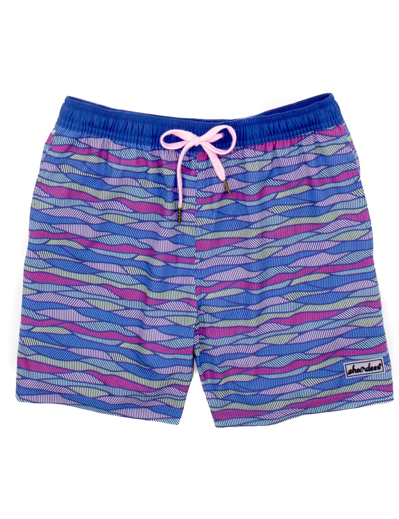 A pair of Properly Tied Men's Shordee Malibu Wave Swim Trunks laid out on a white surface. The swim trunks feature a vibrant wave pattern in shades of blue and teal, with an elastic waistband for a comfortable fit. The image also includes a matching straw hat in the background, available in adult sizes.
